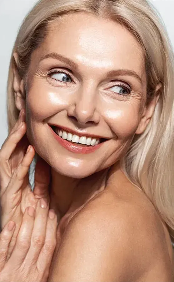 A middle-aged blonde woman with beautiful skin.