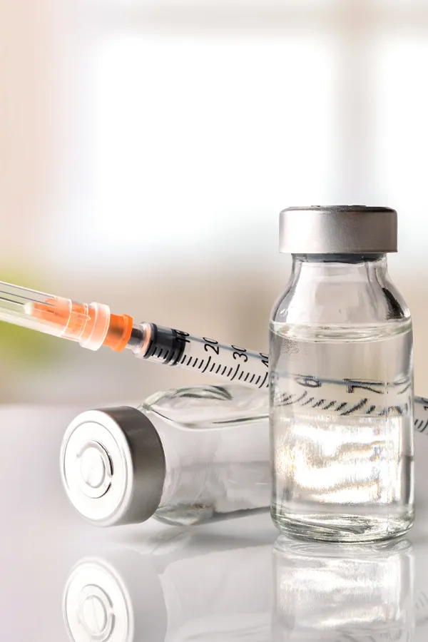 Juvederm-Fillers-Treatment Close-up of vials with fluid and a syringe. Get Juvederm fillers from Thrive Family Practice & Med Spa in Statesboro.