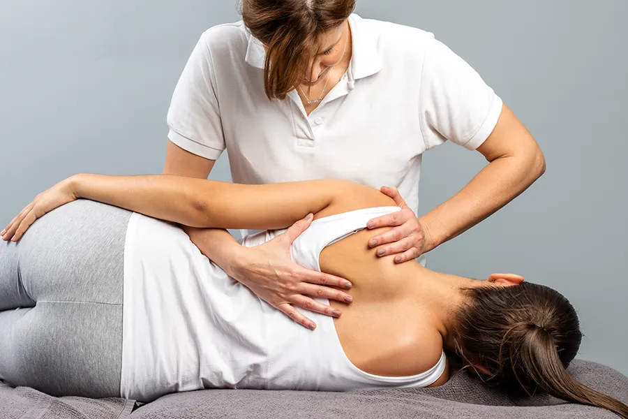 A woman receives a massage. Schedule massage therapy from Thrive Family Practice & Med Spa in Statesboro.