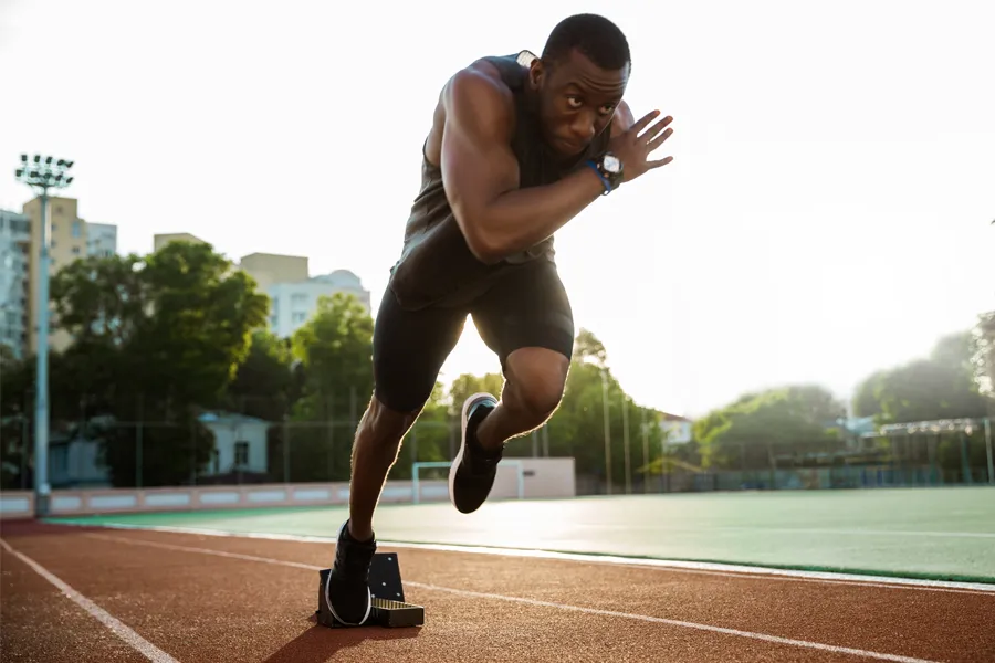 NuFlex-Muscle-Toning-Clinic A black man with highly toned muscles bursts off the starting line on a track. Schedule NuFlex Muscle Toning treatment from Thrive Family Practice & Med Spa in Statesboro.